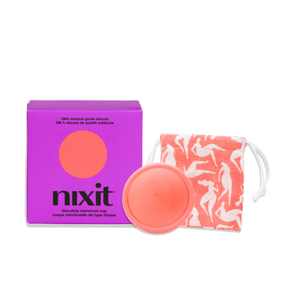 An image of the purple nixit menstrual cup box which has written on it '100% medical grade silicone' and 'nixit disc-style menstrual cup' with the nixit cup next to it as well as a square cotton bag to keep the menstrual cup in.