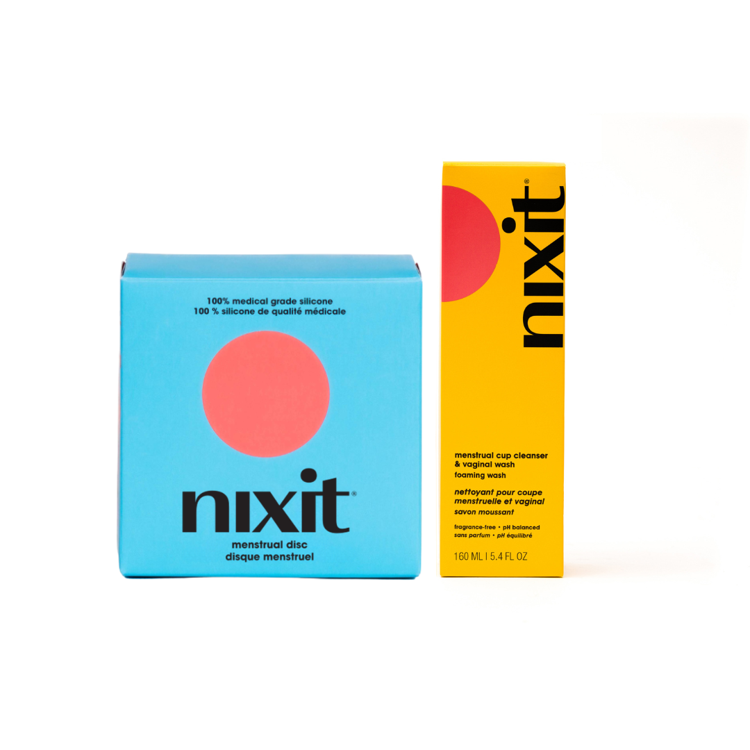 Two Nixit products, a menstrual disc in a blue box and a menstrual cup wash in a yellow bottle, on a white background.