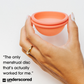 A hand holds the nixit menstrual disc between a thumb and forefinger and a quote is written on the bottom left hand corner: "The only menstrual disc that's actually worked for me." CNN UNDERSCORED.