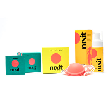 A photo of the boxes of the nixit menstrual cup wipes, nixit disc-style menstrual cup in a yellow box and nixit menstrual cup cleanser and vaginal wash